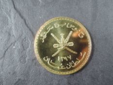 A 1978 Oman 75 Rial Gold Coin, Arabian Tahr to reverse, Uncirculated in plastic capsule and Royal