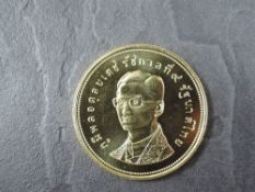 A 1974 Thailand 5000 Bahts Gold Coin, White-eyed River Martin to reverse, Uncirculated in plastic