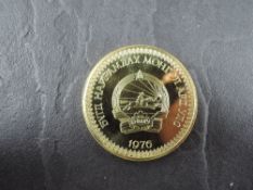 A 1976 Mongolia 750 Togrog Gold Coin, Przewalski Horses to reverse, Uncirculated in plastic