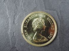 A 1975 Mauritius 1000 Rupees Gold Coin, Mauritius Fly-Catcher with nest on branch to reverse,