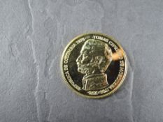 A 1978 Colombia 15000 Pesos Gold Coin, Ocelot near a body of water to reverse, Uncirculated in