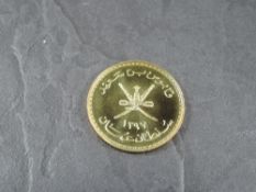 A 1978 Oman 75 Rial Gold Coin, Arabian Tahr to reverse, Uncirculated in plastic capsule and Royal