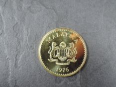 A 1976 Malaysia 500 Ringgit Gold Coin, Malayan Tapir to reverse, Uncirculated in plastic capsule