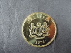 A 1976 Malaysia 500 Ringgit Gold Coin, Malayan Tapir to reverse, Uncirculated in plastic capsule