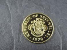 A 1978 Seychelles 1500 Rupees Gold Coin, Flycatcher to reverse, Uncirculated in plastic capsule