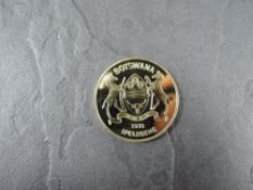 A 1978 Botswana 150 Pula Gold Coin, Brown Hyena to reverse, Uncirculated in plastic capsule, with