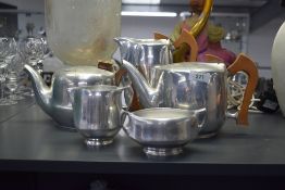 A vintage stainless steel Picquot ware part tea service, comprising of a tea pot, two coffee pots,