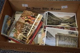 A box containing various postcards and photographs, to include Lakeland, Oud Gouda, Newquay ect
