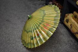 An attractive vintage parasol in the Chinese style, decorated on rice paper with birds and foliage