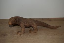 A finely hand carved wooden Komodo Dragon standing on all fours, L39cm
