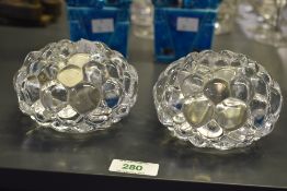 A pair of Orrefors bubble glass candlesticks, raspberry pattern, h7cm