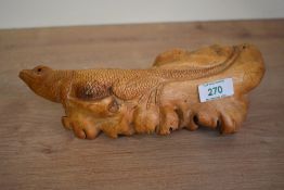 A finely hand carved wooden lizard figure, L27cm