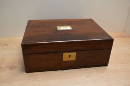 A fitted Rosewood lapdesk with leather skiver and fitted inkwell having brass fittings