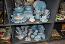 A collection of mid century Poole pottery tea wares, twin tone sky blue colour, to include tea pots,