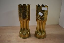 A pair of early 20th century brass trench art vases, fashioned from German artillery shells,