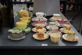 A Carlton Ware Lilly pad pattern part tea service, comprising of tea pot, cup, saucer, milk jug