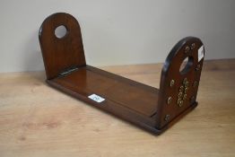 A late 19th / early 20th century oak and brass bound extending book slide decorated in the Gothic