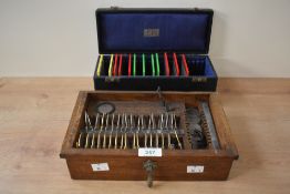 An early 20th century Theodore Hamblin travelling opticians tool kit, w28cm