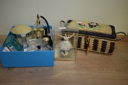 A vintage wicker sewing/jewellery basket, decorated having floral patterns within a purple