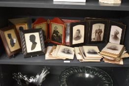 A 19th century miniature silhouette, the profile of a gentleman looking left, behind glass in a