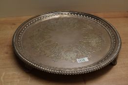 A large silver plated wedding cake stand, of circular form with egg and dart rim having central