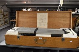 A vintage Astronomical telescope with tripod, cased in an oak box, stamped 'japan', L94cm