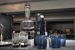 A mid century Caithness blue tinted water jug, h26cm, sold together with 6 blue glasses and another