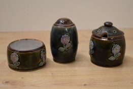 A Royal Doulton stoneware three piece condiment set comprising of mustard pot, shaker and small pot,