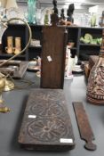 An attractive 19th century carved wooden pot stand, having floral decoration, supported on bun feet,