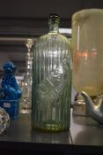 A large 19th century green glass apothecary bottle with the words 'POISON NOT TO BE TAKEN', h36