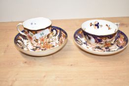 A Royal Crown Derby tea cup and saucer in the Imari pattern, h7cm, sold together with another cup