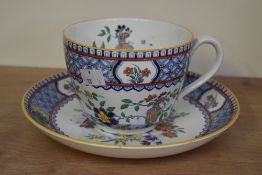 A large early 20th century Minton's hand painted cup and saucer, decorated having colourful oriental