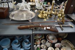 A reproduction British officers brass and leather sword, L96cm, sold together with another sword and