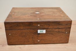 A 19th century rosewood and mother of pearl inlay jewellery box, the interior lined with red