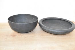 A large late 19th / early 20th century Wedgwood black basalt bowl, impressed makers mark to base,