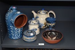A vintage wetheriggs pottery salt kit, decorated having geometric patterns on a blue glaze ground,