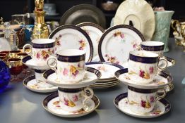 A Regent China part tea service, having gilt edging and hand coloured with foliage on a white