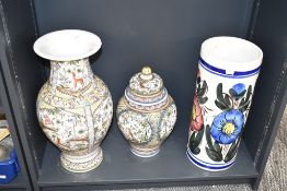 A large mid-century Portuguese vase, hand painted depicting various flora and fauna in the 17th