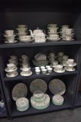 A large Minton fine bone China Haddon Hall pattern dinner service, decorated with colourful