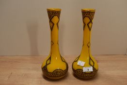 A pair of continental coloured glass baluster vases in the Art Nouveau style, decorated having