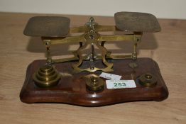 A vintage set of postal scales with metric weights, engraved POSTAL RATES FOR LETTERS NOT