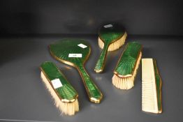 An early 20th century green enamelled dressing table set in the style of Albert Carter, comprising