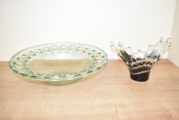 A large contemporary open work thick glass bowl, w41cm, sold together with a splash glass vase,