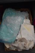 A box containing various silk and lace material.