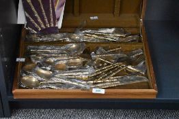 A oak canteen of Thia bronze bamboo pattern cutlery, to include forks, knives and spoons,