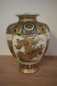 A large early 20th century imperial Satsuma style baluster vase, richly gilded and enamelled