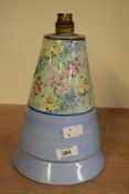 An attractive vintage Shelley triangular table lamp, partly decorated having floral patterns, makers