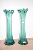 Two mid-century ruffled green glass vases, one slightly taller than the other, H45cm and H42cm.