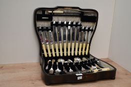 A vintage oak canteen of cutlery, etched mark 'Thomas Turner & Co Sheffield', stamped British Reg