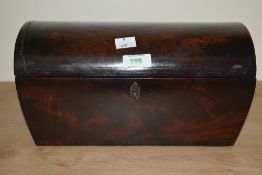 A 19th century flame mahogany dome topped tea caddy, having brass handles to either side, the velvet